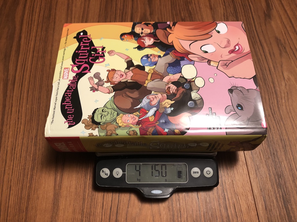 The Unbeatable Squirrel Girl Omnibus resting on a kitchen scale. The scale reads 4.150kg.